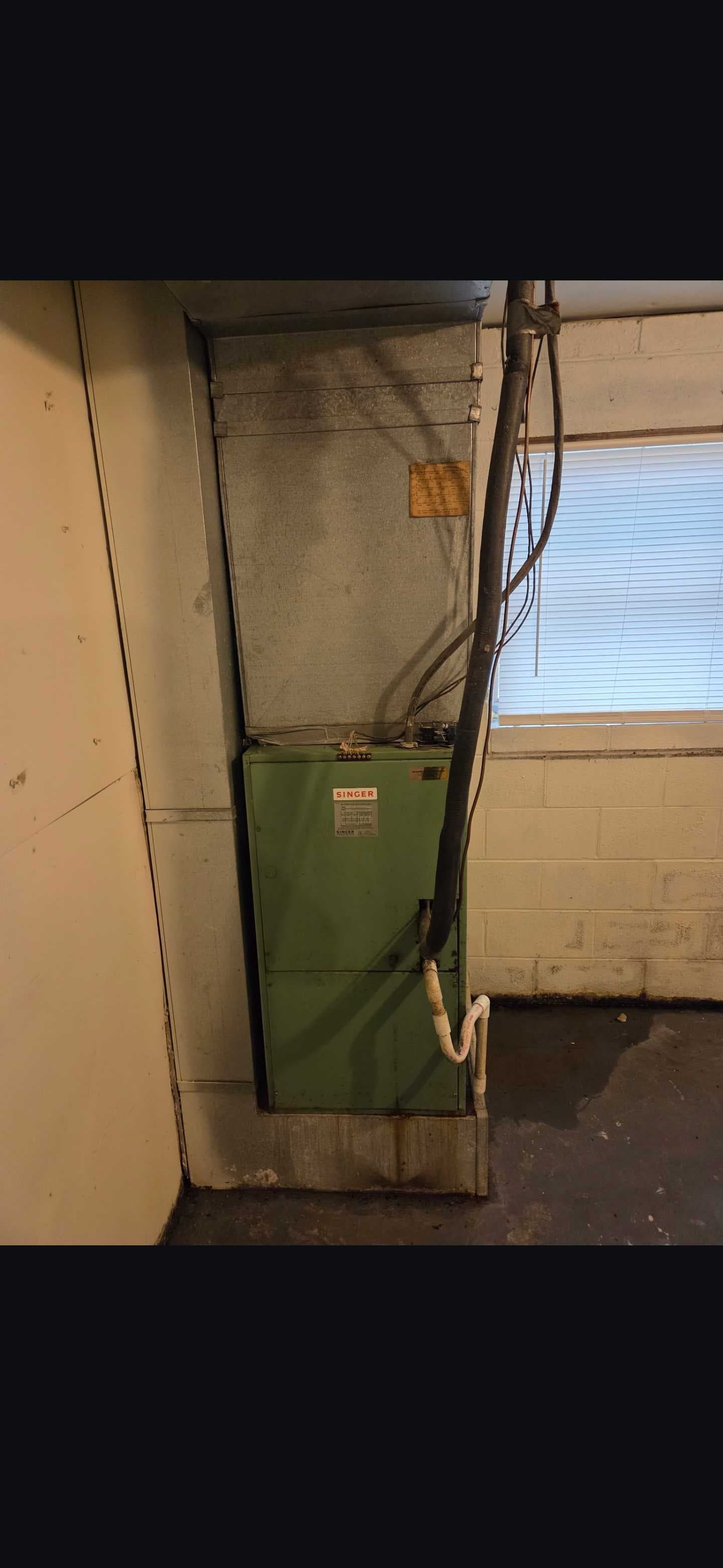 The original indoor HVAC equipment before replacement.