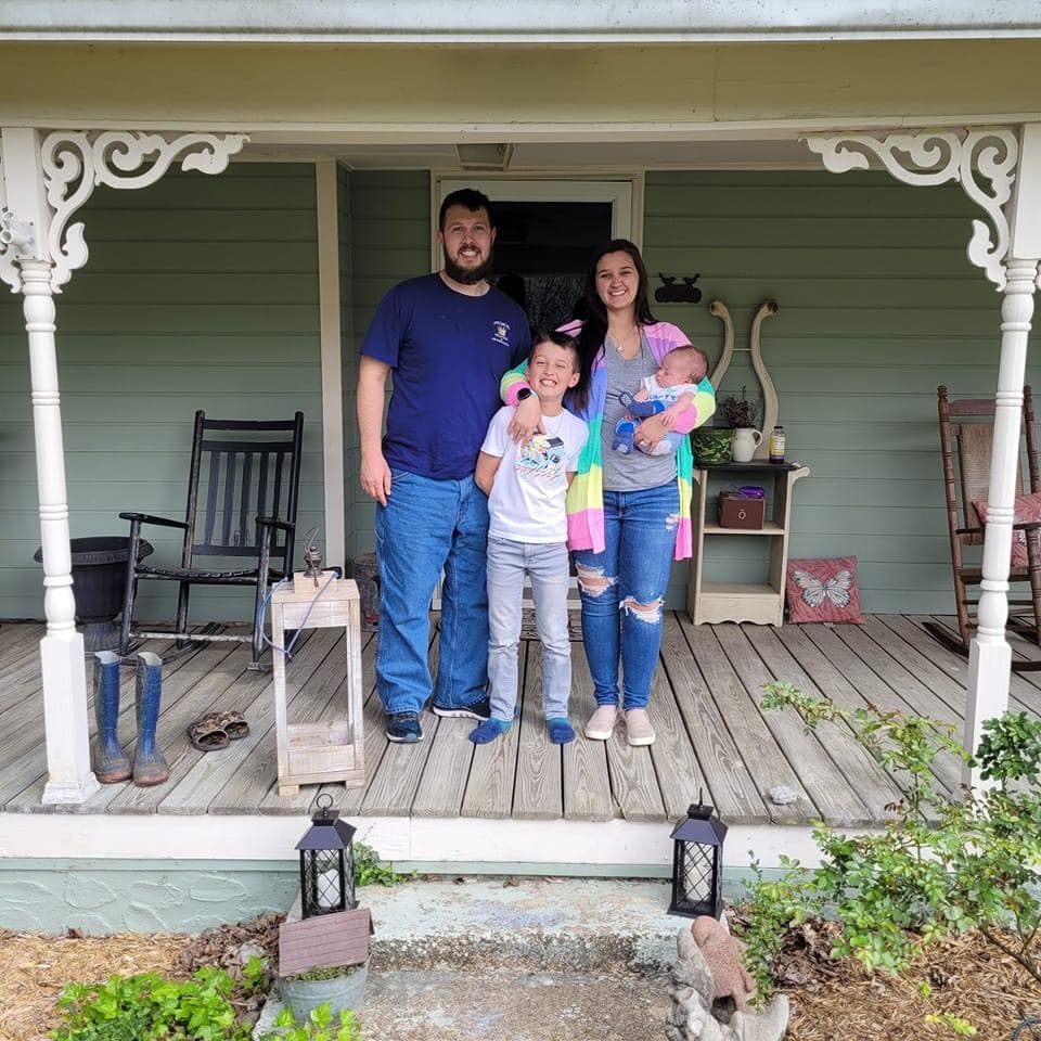 Seth Prince with his family on their porch